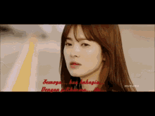 a close up of a woman 's face with the words semoga kan bahagia written in red