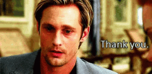 a close up of a man 's face with the words `` thank you '' written on the bottom .