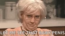 a woman wearing glasses and a wig is making a funny face and says `` let me see that baby penis '' .