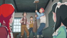 a group of children are standing around a boy holding a mop