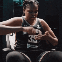 a female basketball player wearing a number 35 jersey
