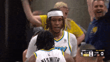 a basketball player with the name nes smith on their jersey