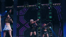 a woman is singing into a microphone on stage .