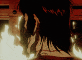 a close up of a person 's face with fire coming out of his mouth