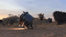 a robot is standing in the middle of a desert landscape