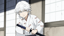 a boy with white hair is holding a sword in front of a window