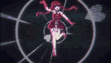 a girl in a red dress is standing in a pink circle in a dark room .