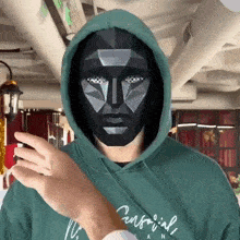 a person wearing a green sweatshirt that says central