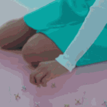 a close up of a woman 's face with her eyes closed and a sad look on her face .
