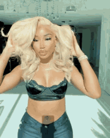 a woman with blonde hair is wearing a black top