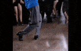 a group of people are dancing on a dance floor in a club .