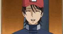 a man wearing a red hat with a square on it