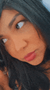a close up of a woman 's face with her eyes closed