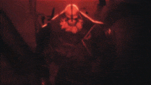 the word deus is written in red on a dark background