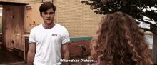a man in a white t-shirt with the word " willowdean " on it