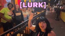 a group of people standing in front of a fence with the words [ lurk ] written above them