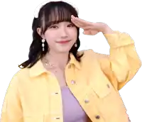 a woman wearing a yellow jacket salutes with her hand