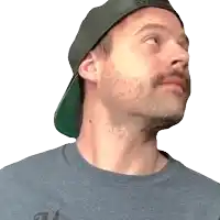 a man with a beard wearing a hat and a gray shirt with the letter a on it