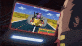 a man is looking at a computer screen with a picture of a cartoon character on it