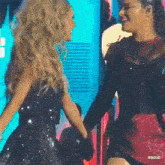 two women are holding hands on a stage with the watermark rbd3d