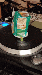 a bag of tortilla chips sits on a record player