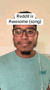 a man wearing glasses and a t-shirt that says ' reddit is awesome ( song ) ' on it