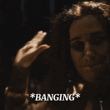a close up of a woman 's face with the words * banging * on the bottom