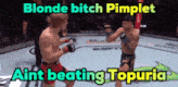 blonde bitch pimplet aint beating topuria is written on the bottom of a boxing match