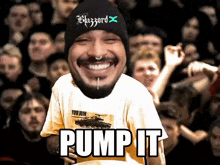 a man wearing a blizzard hat stands in front of a crowd and says pump it