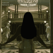 a woman in a white dress is standing in a hallway with a chandelier in the background