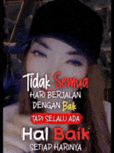 a woman wearing a black hat with the words " tidak semua hari berjalan dengan baik " written on it