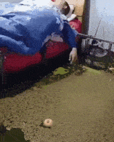a person is laying on a bed in a puddle of water