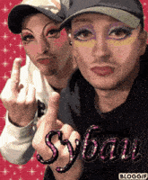 a picture of two men with makeup on their faces and the name syban on the bottom