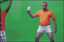 a group of men are dancing in front of a green screen with the website 4gifs.com visible