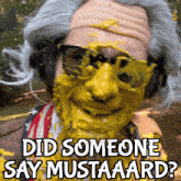 a man with mustard on his face is wearing sunglasses