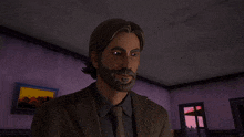 a man in a suit and tie is smiling in a room with a picture on the wall