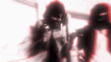 a blurry picture of a man with a hood on