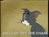 a cartoon cat is sitting in a chair with the words `` just got off the chair '' written on it .