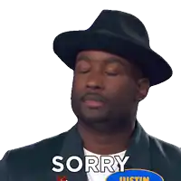 a man wearing a hat says sorry in front of a justin logo
