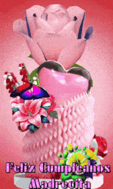 a feliz cumpleanos madrecita card with flowers and a heart