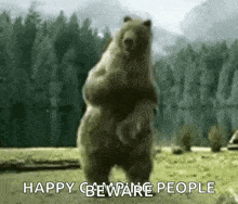 a bear is standing on its hind legs in a field with the words `` happy beware people '' .