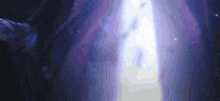 a person is standing in a dark room with a purple light coming out of the door .