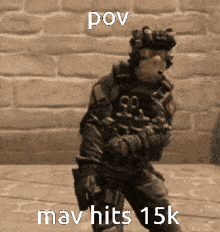 a soldier is holding a gun in front of a brick wall with the caption " pov mav hits 15k "