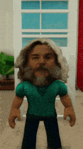 a cartoon character with a beard and long hair is wearing a teal shirt