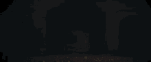 a person in a dark room with a red light shining on them