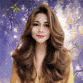 a woman with long brown hair is standing in front of purple flowers