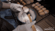 a person is mixing something in a bowl that says made in animonica