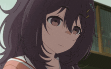 a close up of a girl 's face with green eyes