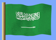a green and white flag with arabic writing on it is waving in the wind