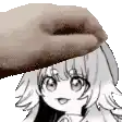 a hand is holding a piece of paper over a girl 's head .